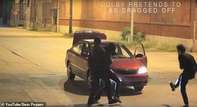In the video, Golbach was shoved into the boot of a car with a bag over his head