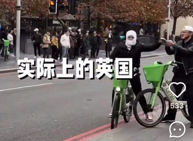 Daylight robbery: Beijing Coco shows a thief wearing a balaclava and while riding a Lime bike and says: 'Thieves being filmed on camera mugging phones in the big city'