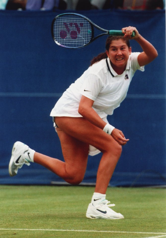 Monica Seles playing tennis.
