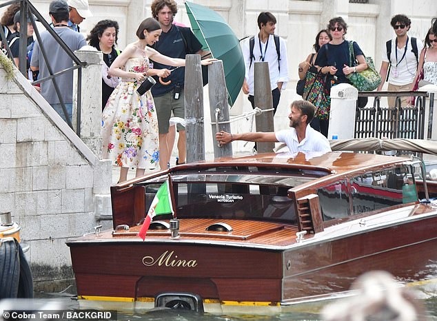 Collins, who wore a colourful floral dress and hooped earrings, was carrying a water flask and appeared focussed