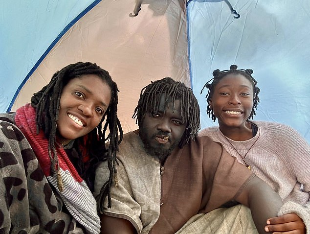 Taylor (right) is pictured with Queen Nandi (left) and King Atehene (center). Atehene, real name Kofi Offeh, is the leader of the trio and is married to Nandi, real name Jean Gasho