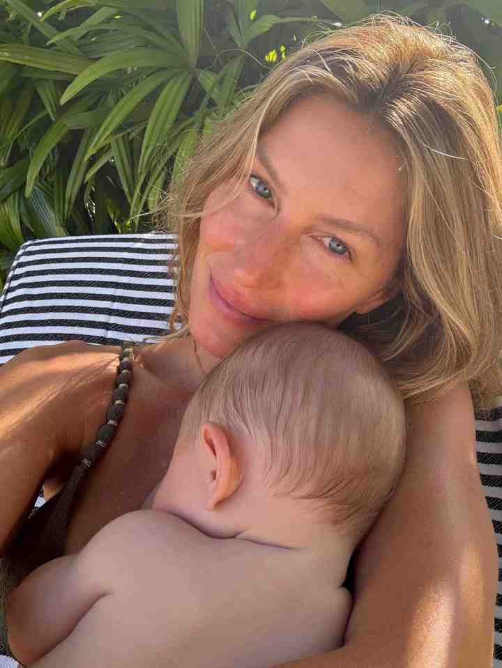 Gisele Bündchen holding a baby.