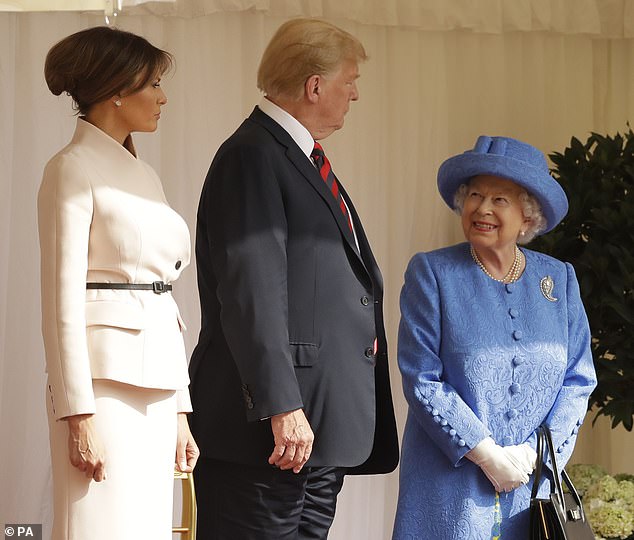 Trump and Melania walk from the Quadrangle at Windsor after inspecting the Guard of Honour in 2018
