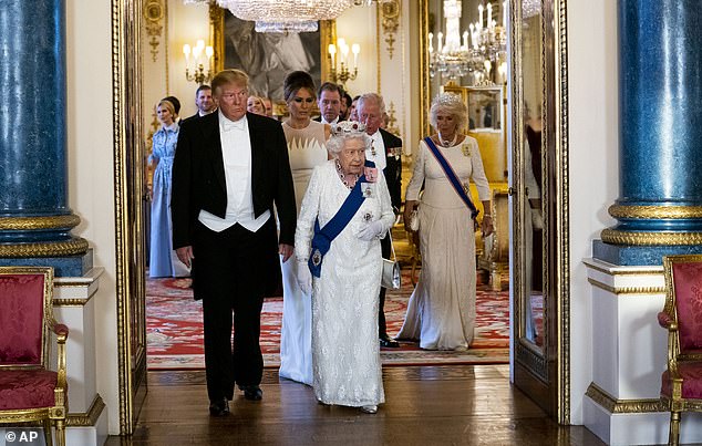Trump and Melania Trump with Queen Elizabeth walking into the Music Room for a State Banquet at Buckingham Palace in June 2019