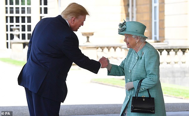 Trump is seen fist-bumping Queen Elizabeth during a trip to London in June 2019