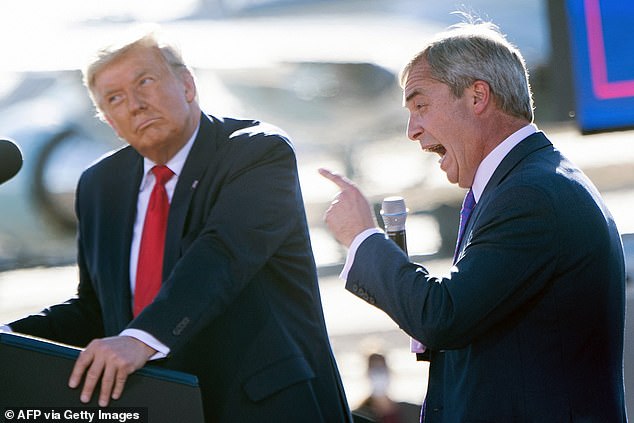 Trump listens as Nigel Farage speaks during a Make America Great Again rally at Phoenix Goodyear Airport in October 2020