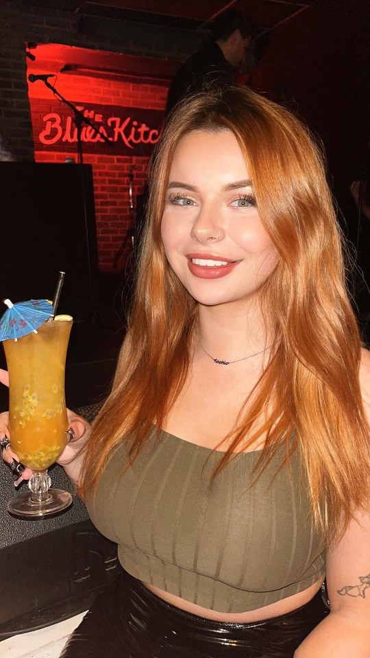 Woman at The Blues Kitchen with a cocktail.