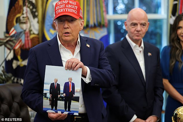 US President Donald Trump holds an image of him and Russian President Vladimir Putin from their meeting in Alaska, August 22, 2025