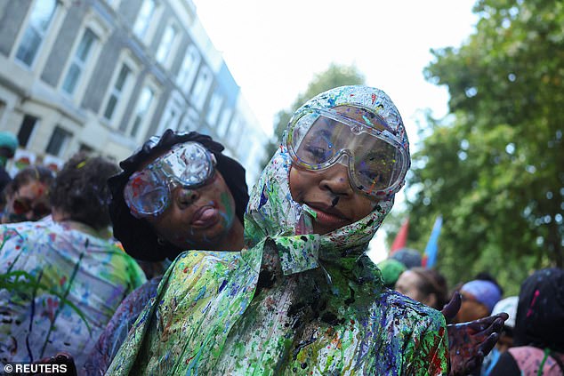 Revellers were seen wearing goggles to protect themselves from the paint being splattered everywhere