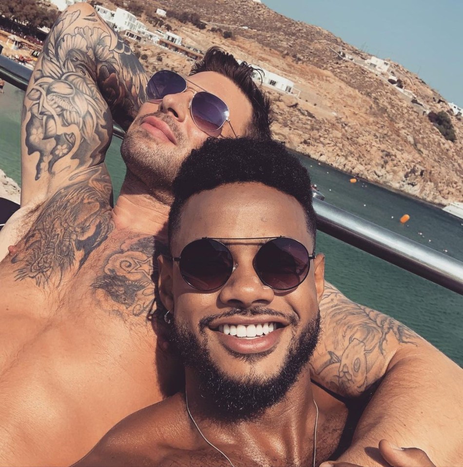 Duncan James of Blue and another man relaxing outdoors.