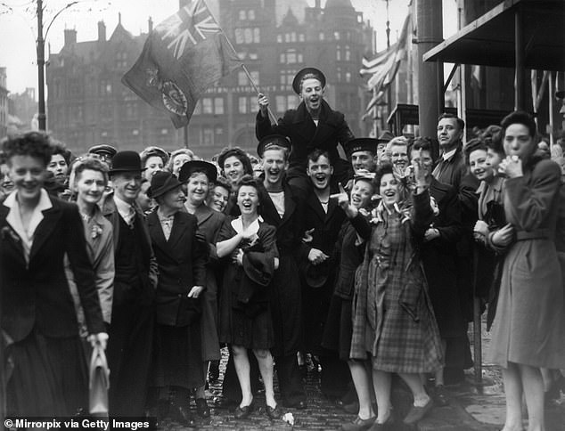 Huge crowds celebrating Victory in Japan on August 15, 1945 in Albert Square, Manchester