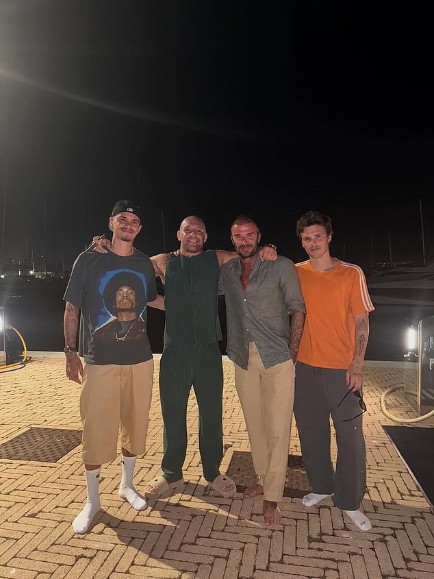 McGregor posed for photos alongside Beckham's two youngest sons, Romeo(left) and Cruz(right)