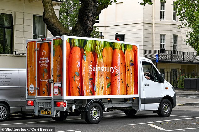 Delivery van for Sainsbury's supermarket driving on a street in central London