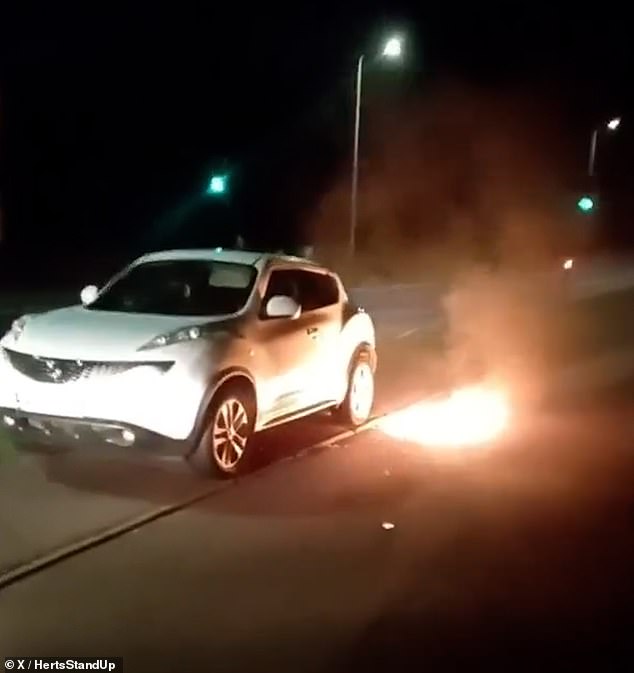 Footage from the incident posted on social media by StevenagePatriots show the bottle ablaze on the ground and close to the rear tyres of a parked car
