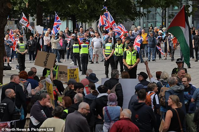 Protesters clash in Newcastle yesterday as a far right group campaigning against migrants in the New Bridge Hotel stand off against a counter group defending the refugees