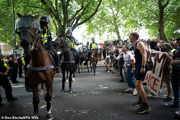 Mounted police officers are deployed during a protest by Abolish Asylum System and counter demonstrators at Castle Park in Bristol yesterday