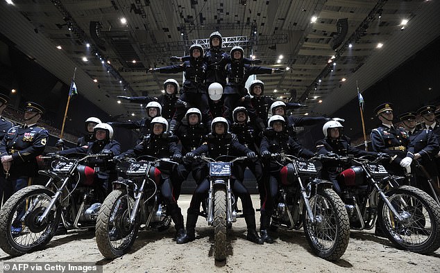 Mr Cotterill had to learn the human pyramid and claims he would usually be at the bottom and had the weight of his colleague passing through his neck, shoulders and spine. (File image of soldiers from the White Helmets)