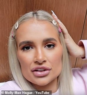 The former Love Island star has previously admitted she didn't recognise herself by the time she reached the age of 21, having had a variety of cosmetic procedures done (pictured with filler in 2019)
