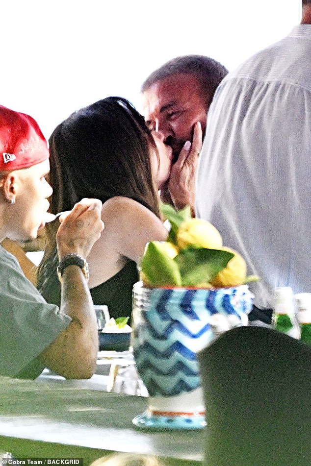 The couple locked lips in a passionate display