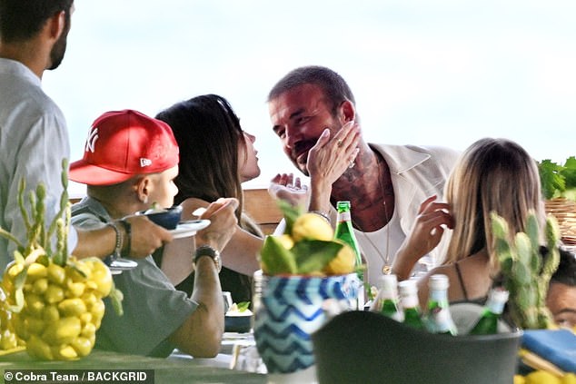 Victoria held her husband's face in her hands