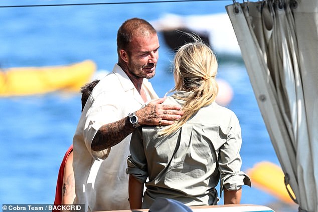 David was spotted chatting to a blonde woman on the boat