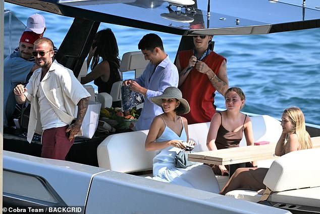 The family were also seen travelling to and from the restaurant location on a boat and were sat around the table together chatting