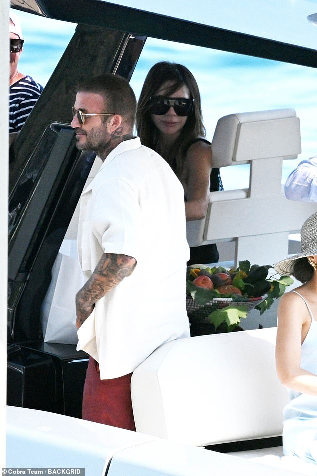 David looked equally stylish in a relaxed off-white short sleeved shirt and red trousers with a pair of sunglasses