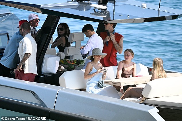 The family arrived at the restaurant on a smaller boat from their superyacht