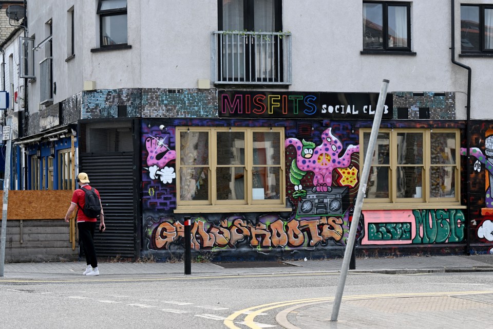 Misfits Social Club building with graffiti.