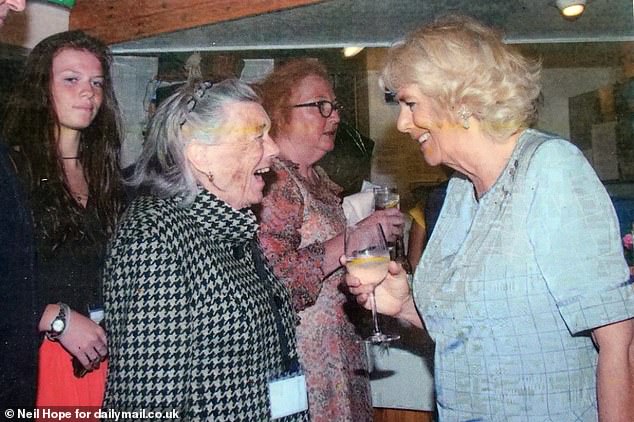 A picture of Pilcher meeting Queen Camilla