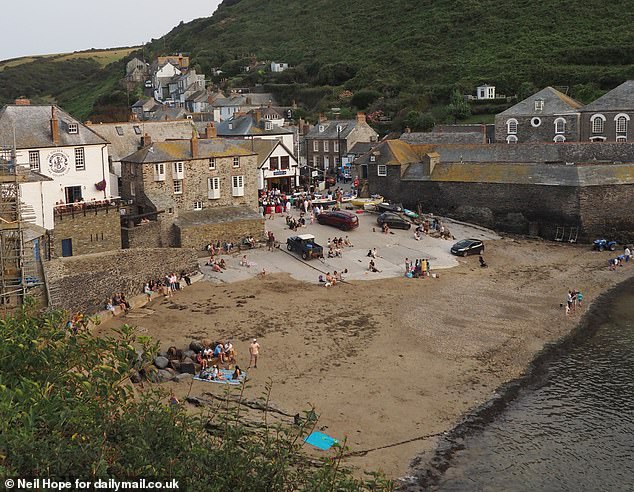 Pilcher's books have made Cornwall so popular that Germans flock to the picturesque seaside area every year to take in the scenery. Pictured: Port Isaac, a frequent Pilcher filming location