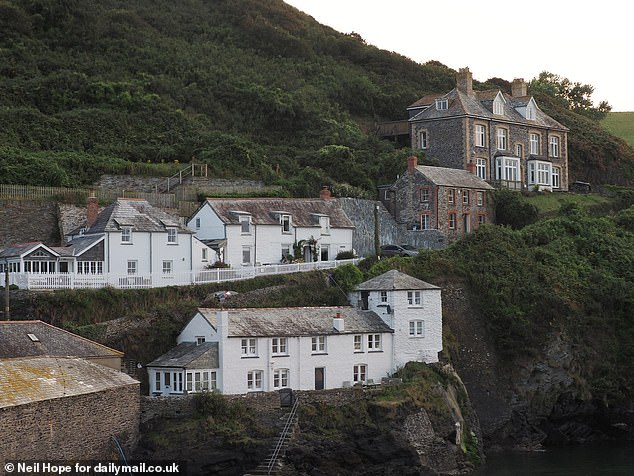 German visitors enjoy walking along the coastal path and visiting the beautiful buildings nestled in towns and villages along the way. Pictured: Port Isaac