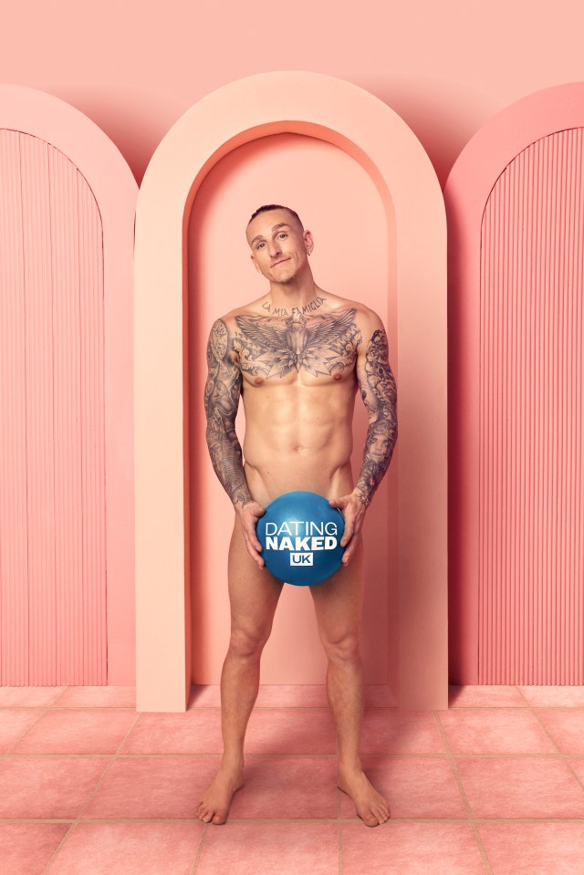Rylan Clark holding a Dating Naked UK ball.