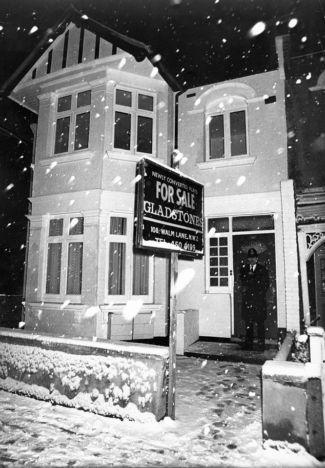 A police officer is seen outside Nilsen's former Cricklewood home after his arrest in 1983