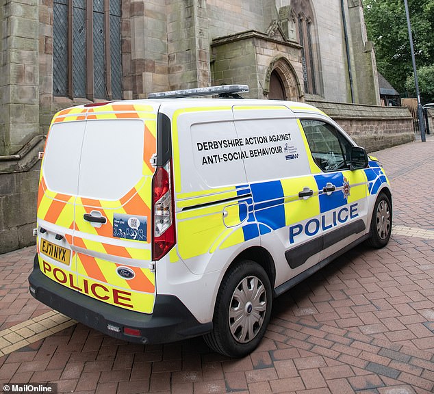 A marked police van with 'Derbyshire Action Against Anti-Social Behaviour' was parked glaringly in the street