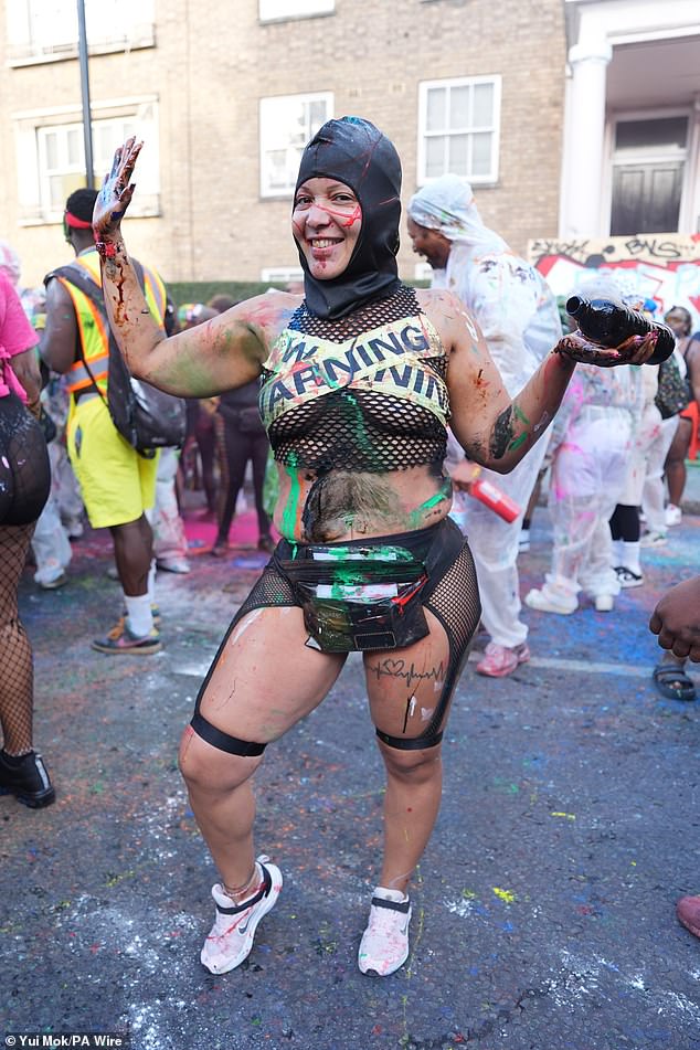 People taking part in J'ouvert ahead of the Children's Day Parade today