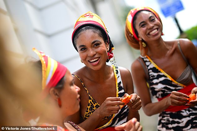 Revellers dressed up in Zebra and leopard patterned outfits during Notting Hill Carnival