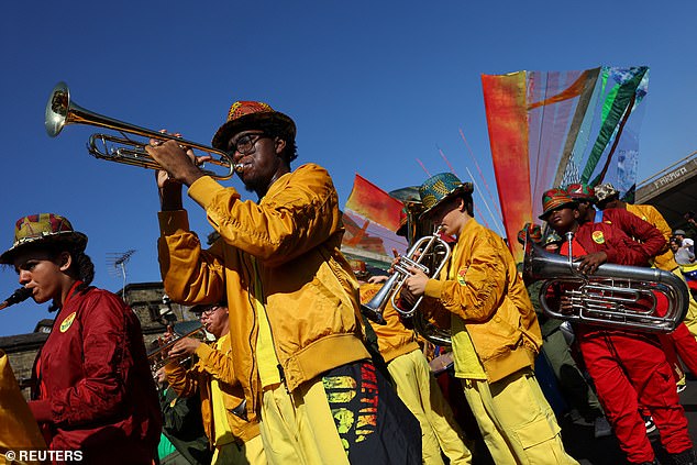 Performers take part in the Children's Day Parade today in Notting Hill