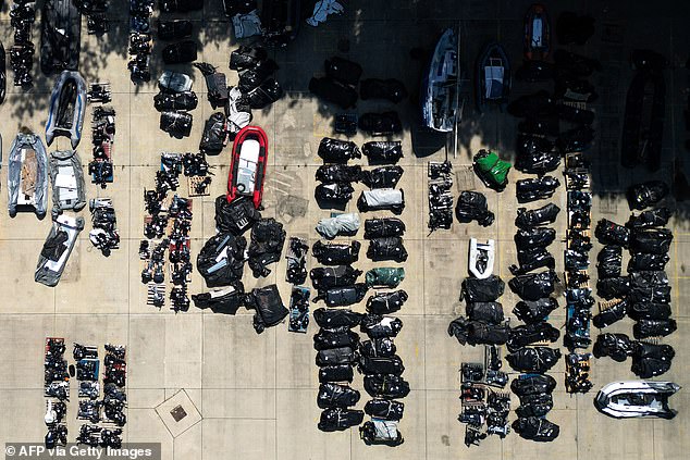 An aerial photograph shows inflatable dinghies and outboard engines believed to have been used by migrants to cross the channel and stored in a Port Authority yard in Dover, south-east England, on August 17, 2025