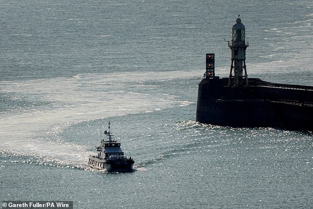 A group of people thought to be migrants are brought in to the Border Force compound in Dover, Kent, onboard a Border Force vessel following a small boat incident in the Channel. Picture date: Friday August 15, 2025