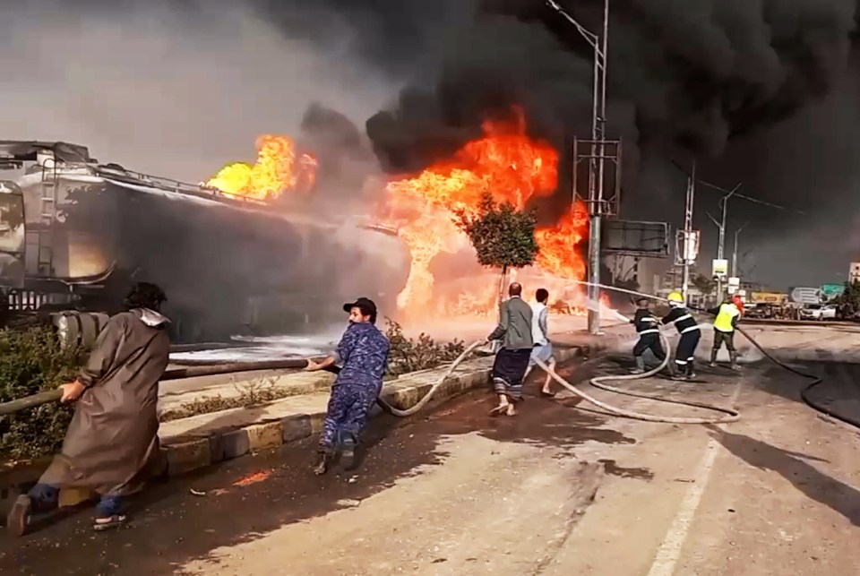 Firefighters battling a large fire.