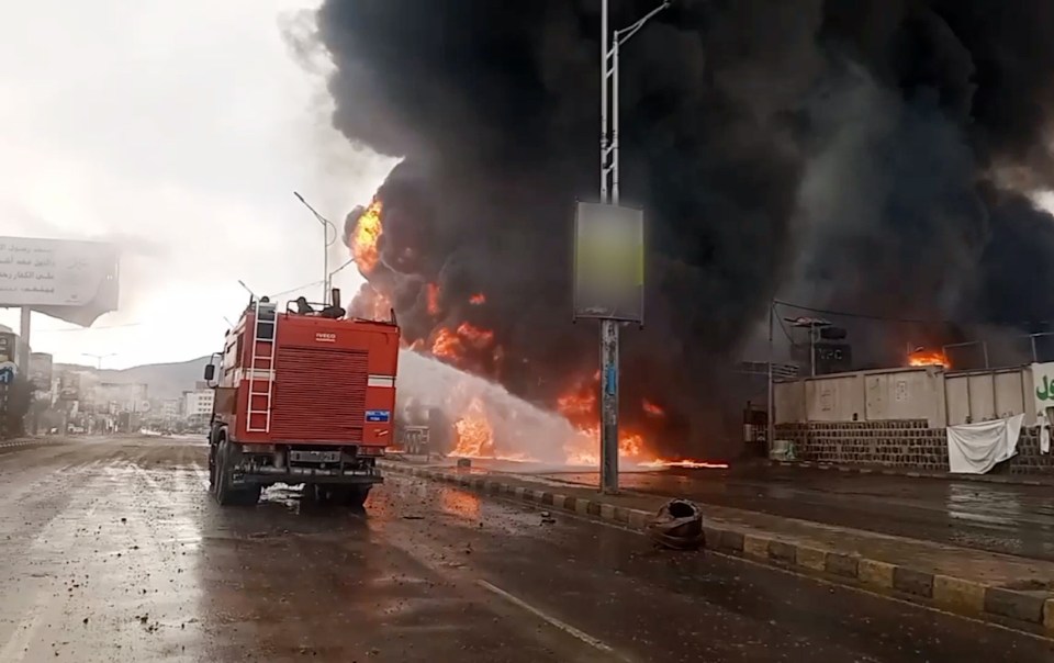 Firefighters battling a large fire in Sanaa, Yemen.