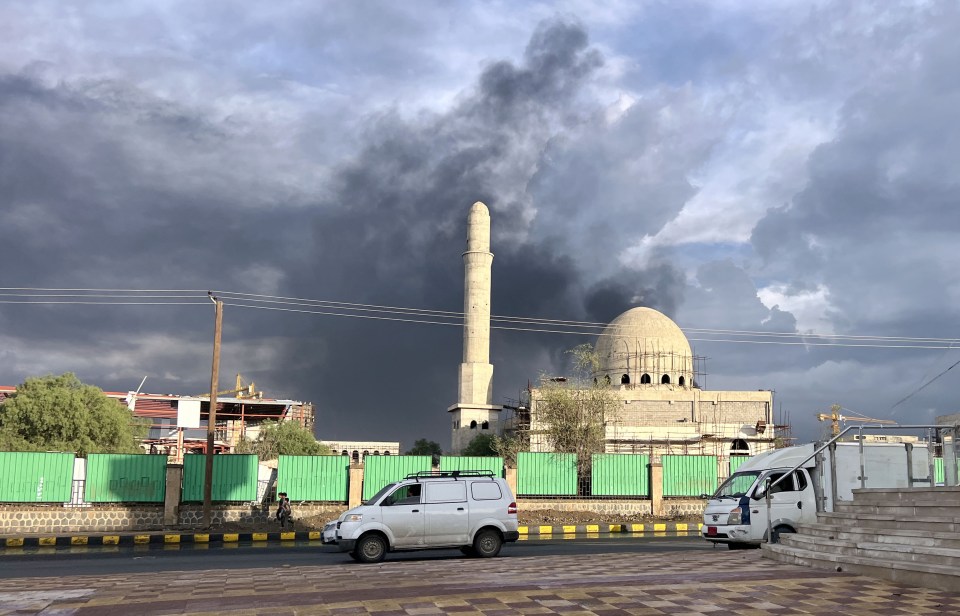 Smoke rises over a mosque under construction in Sanaa, Yemen.