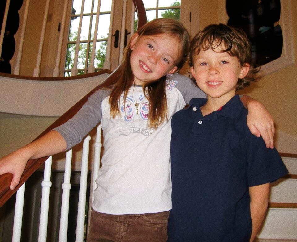 Photo of a girl and boy siblings.
