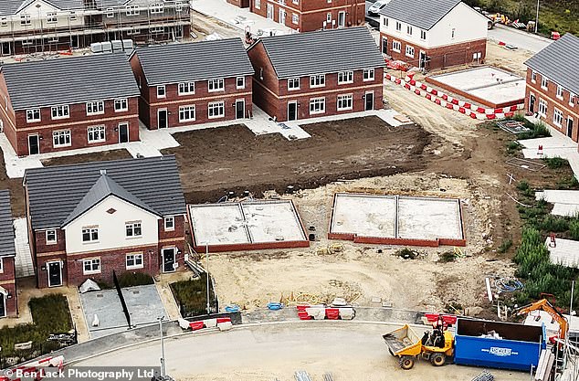 Pictured: Two of the the six bare foundations of what was once brand new semi-detached homes
