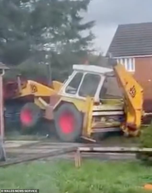 A woman who lives in the estate told of how she rang the police as soon as she saw what looked to be a teenager driving the JCB