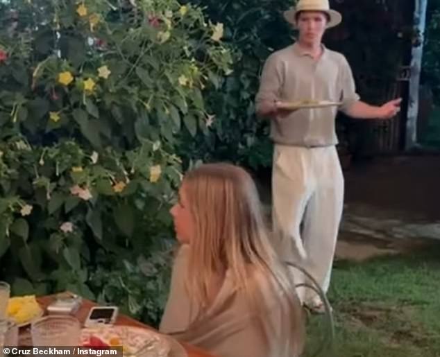 Elsewhere Cruz shared a clip of himself strolling over to the dinner table past his sister Harper while holding a pizza as the family dined Al Fresco
