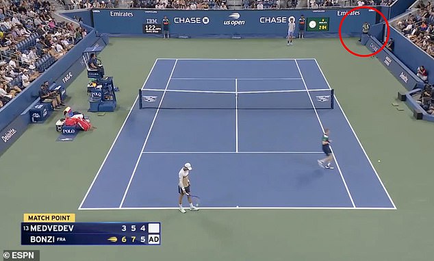 The shocking moment the bumbling photographer walks onto the court at match point