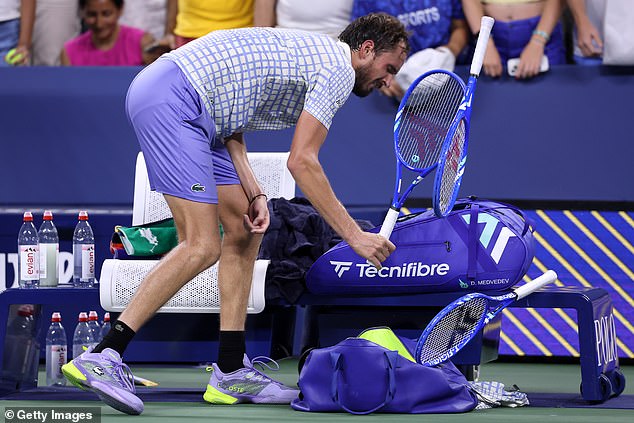 As his opponent attempted to soak up his win, Medvedev furiously smashed his racket 11 times