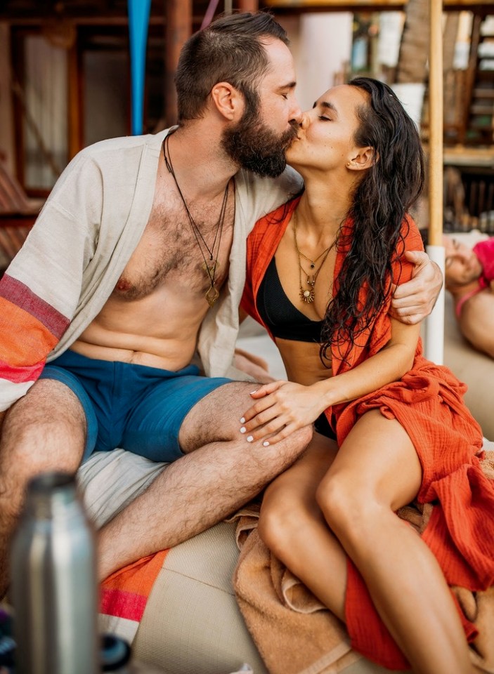 A couple kissing.